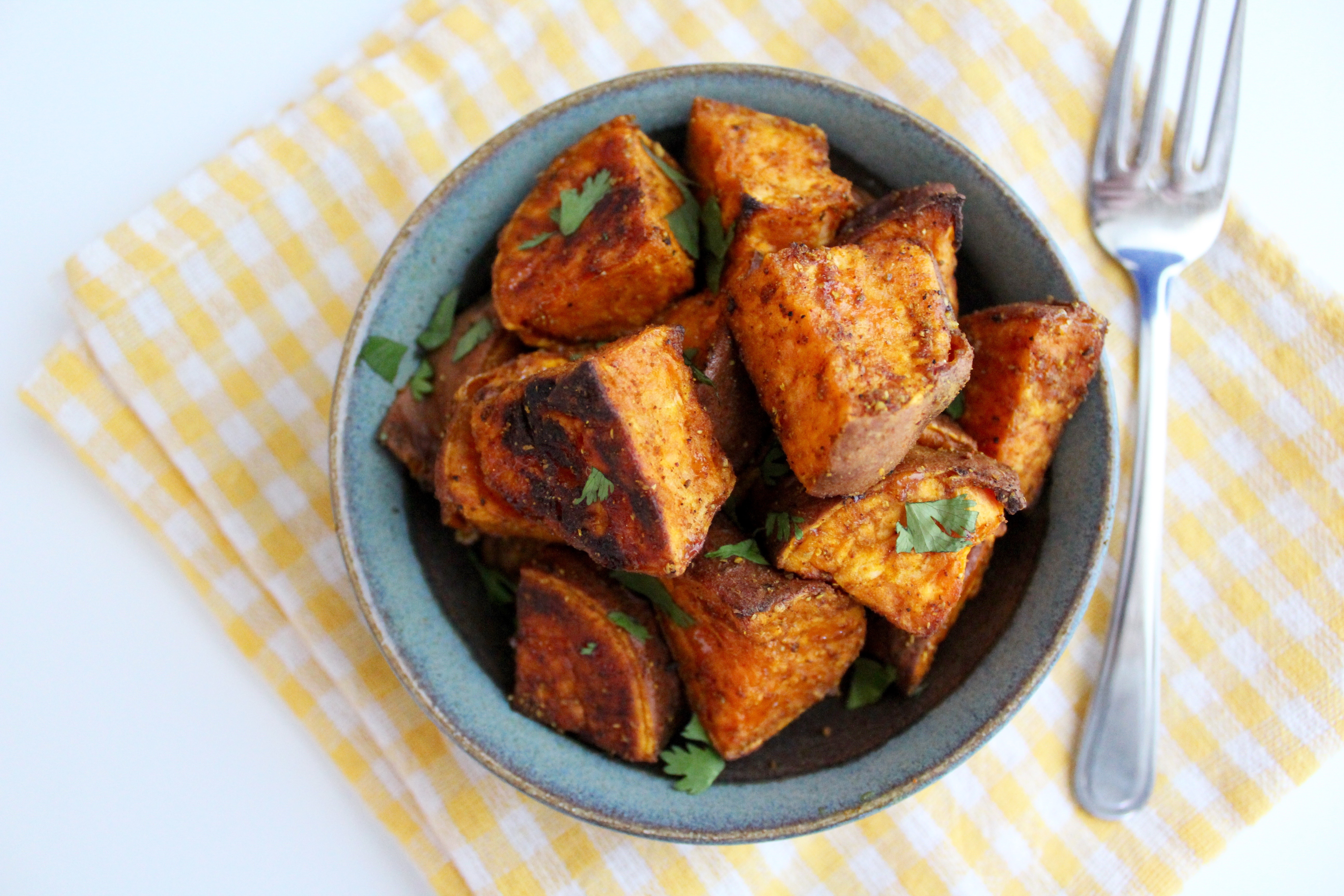 YUM! These Spicy Curry Roasted Sweet Potatoes are unreal!! The best sweet and spicy dish!