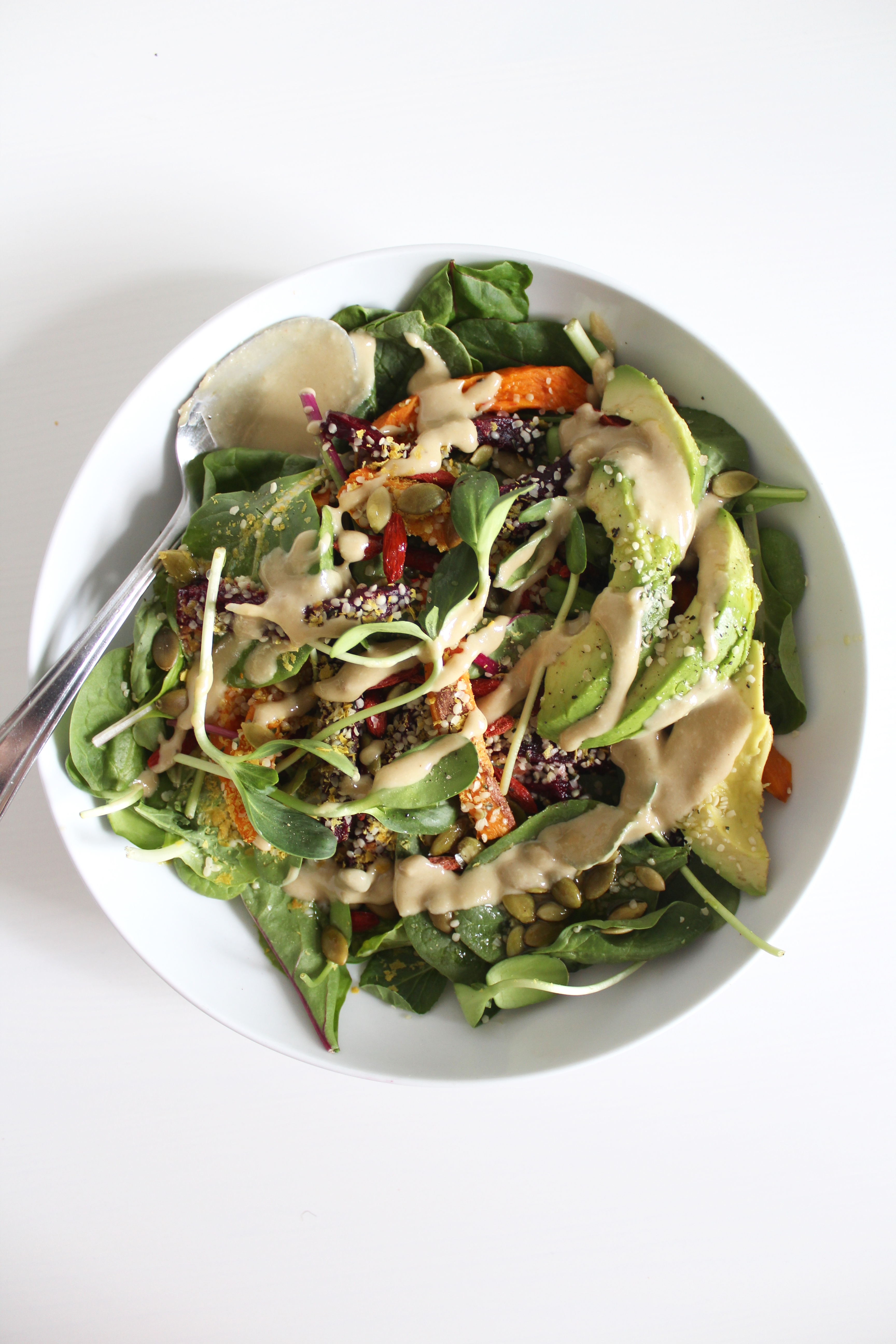 Salad with roasted sweet potato and beets with tahini dressing